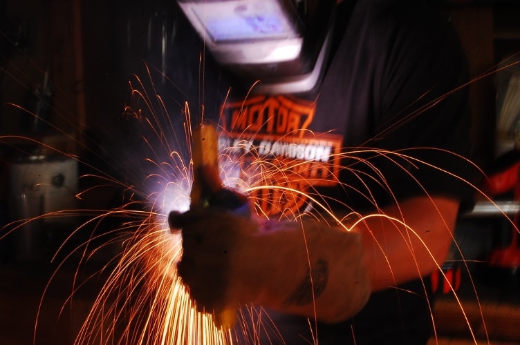 A welder using a symbol blueprint