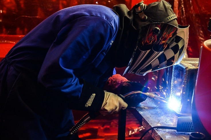 welder with awesome helmet