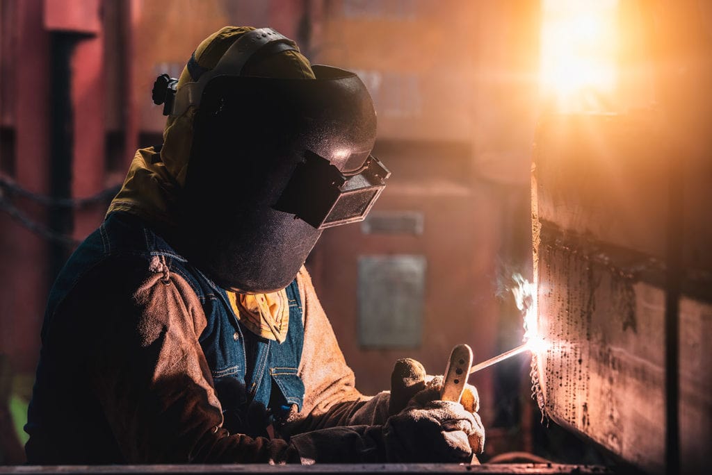 man doing stick welding