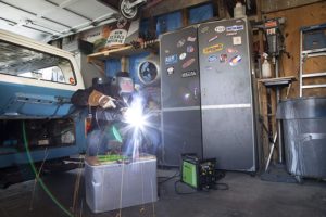 person using Forney 430 220 ST PRO Welder
