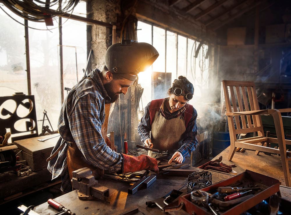 welder and apprentice in the workshop