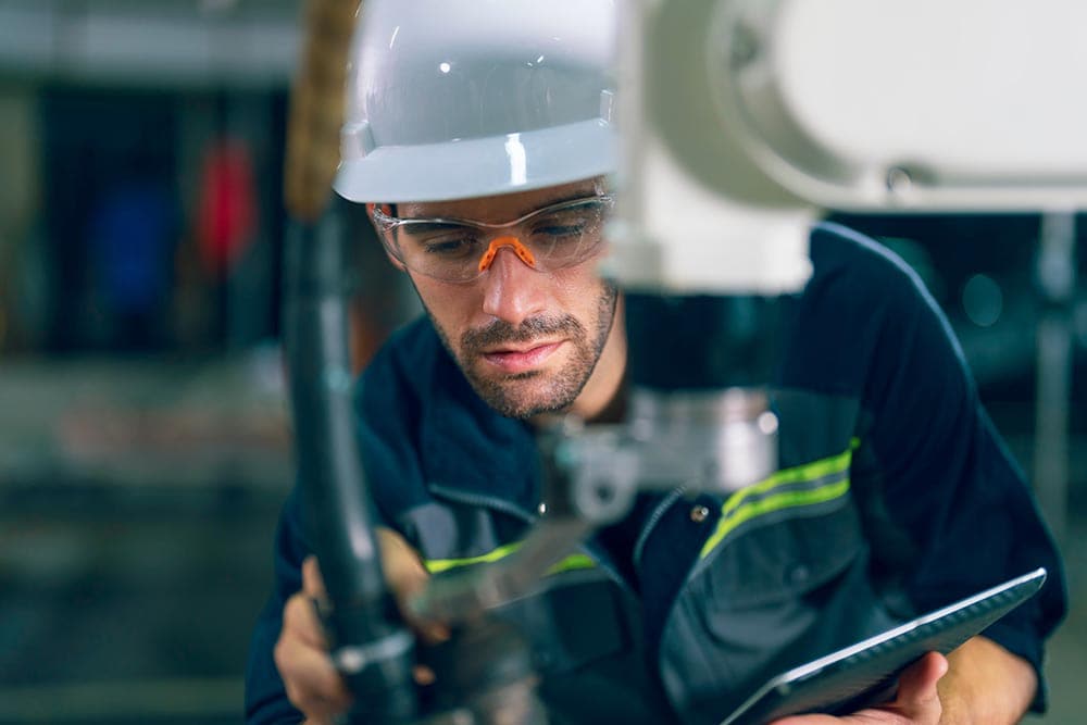 close up welding technician repairing machine