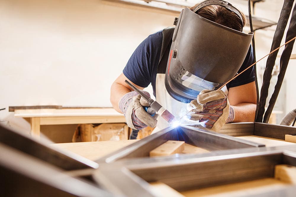 newbie welder working on argon-arc welding