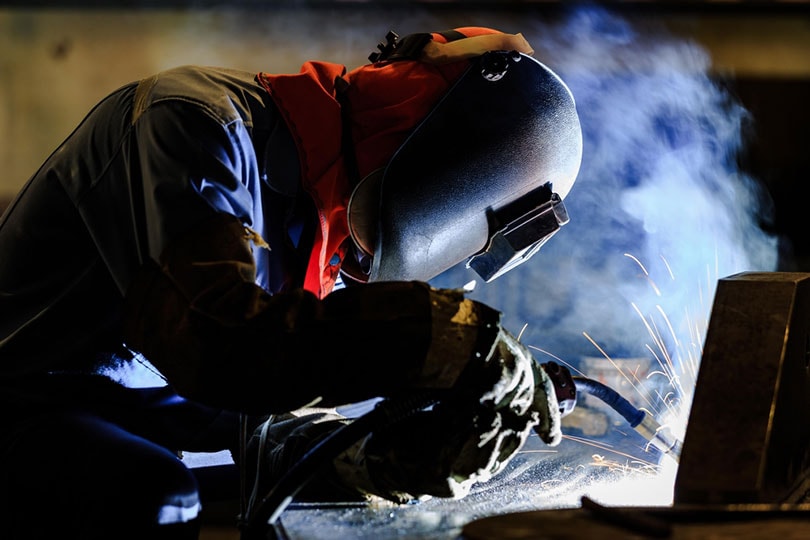 welder welding stainless steel with flux cored wire arc welding process