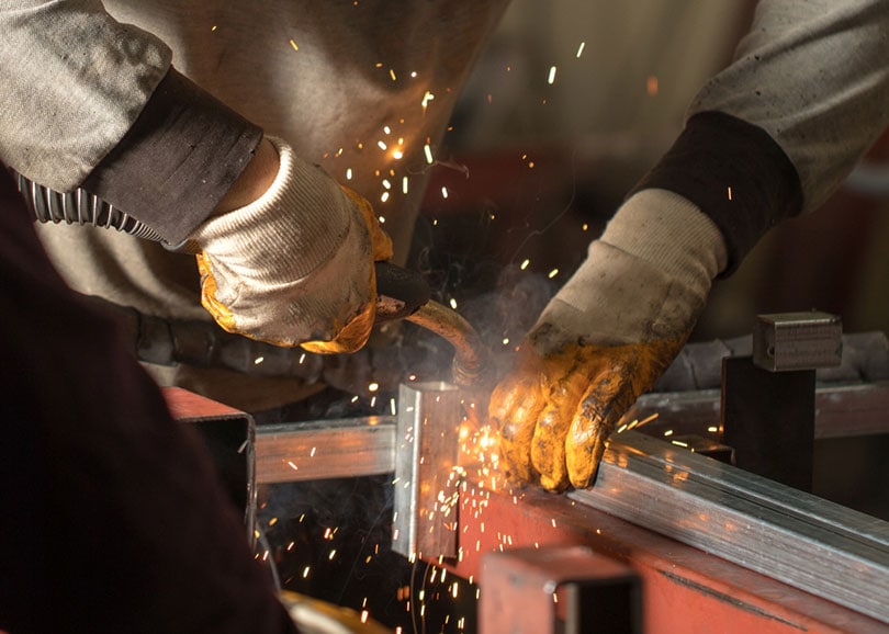 welder working at the factory made metal and galvanized pipe