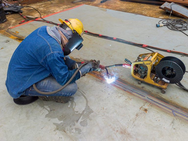 FCAW Vs MIG Welding Differences When To Use Them WaterWelders   Welder Doing FCAW Welding Process Thaweesak Thipphamon Shutterstock 768x576 